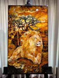 Panels of amber and Karelian birch "Lion in the savanna"